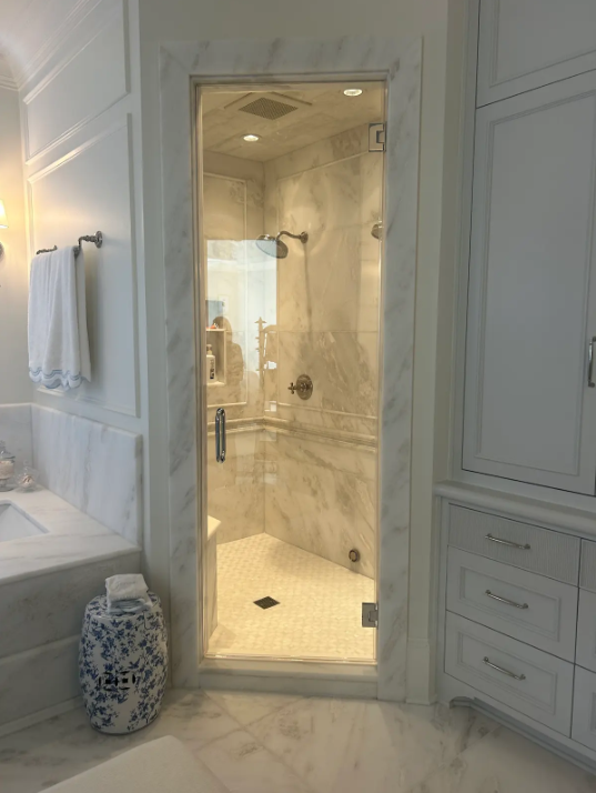 This is a single door steam enclosure remodel with gorgeous chrome hardware finishes from At Home Handyman & Remodel!