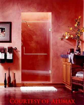 Alumax Shower. This studio picture from Alumax is a great example of the use of a towel bar and handle combination. Other styles are also available. We are an Alumax dealer for framed and sliding semi-frameless shower doors.