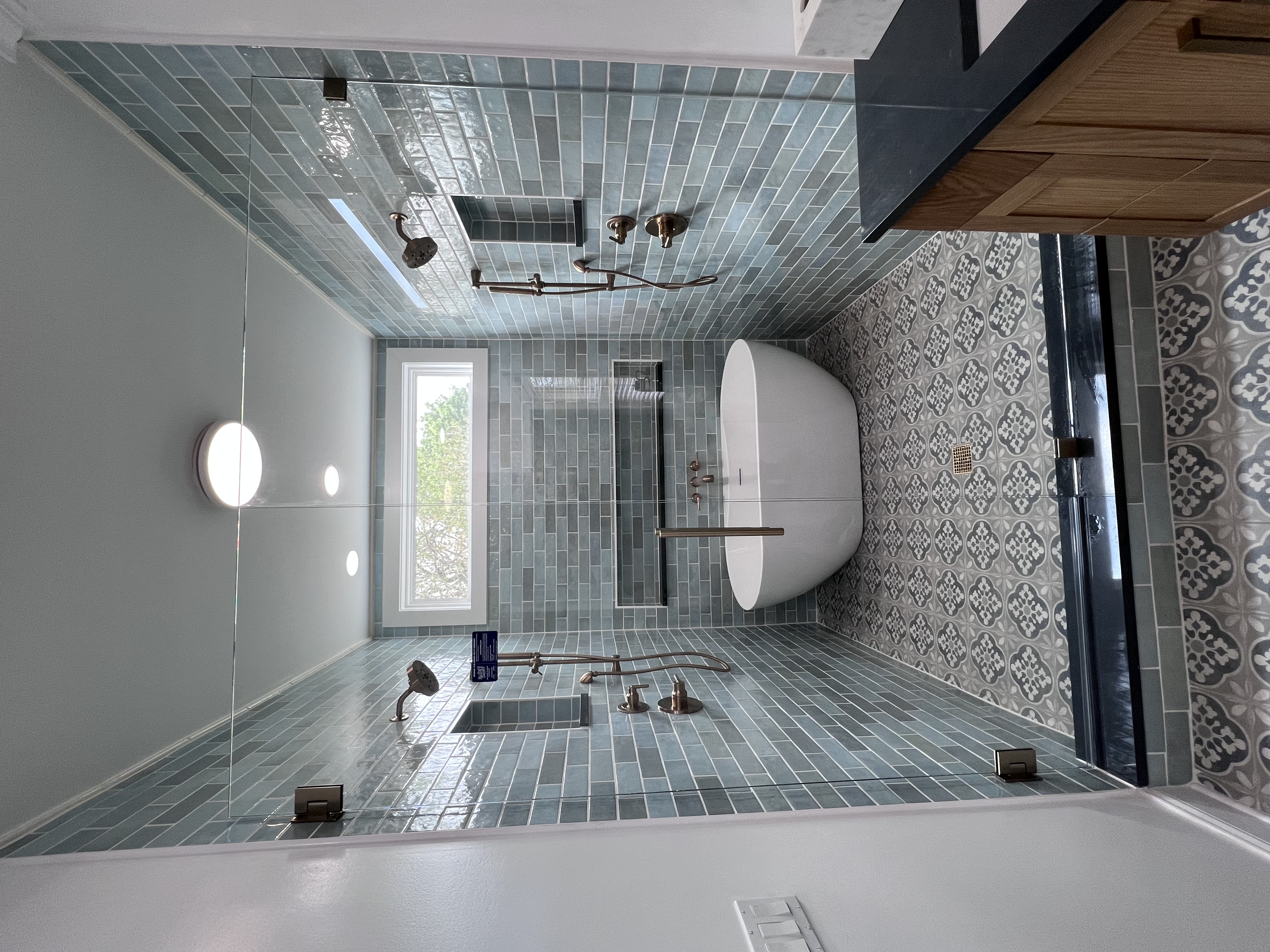 This is a stunning wet room with aqua/blue tile and brushed nickel finishes! 