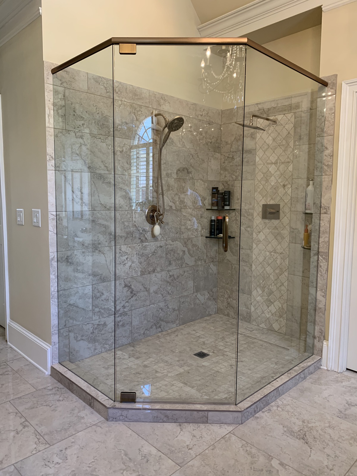 This shower is using antique brass hardware which is very unique and beautiful!